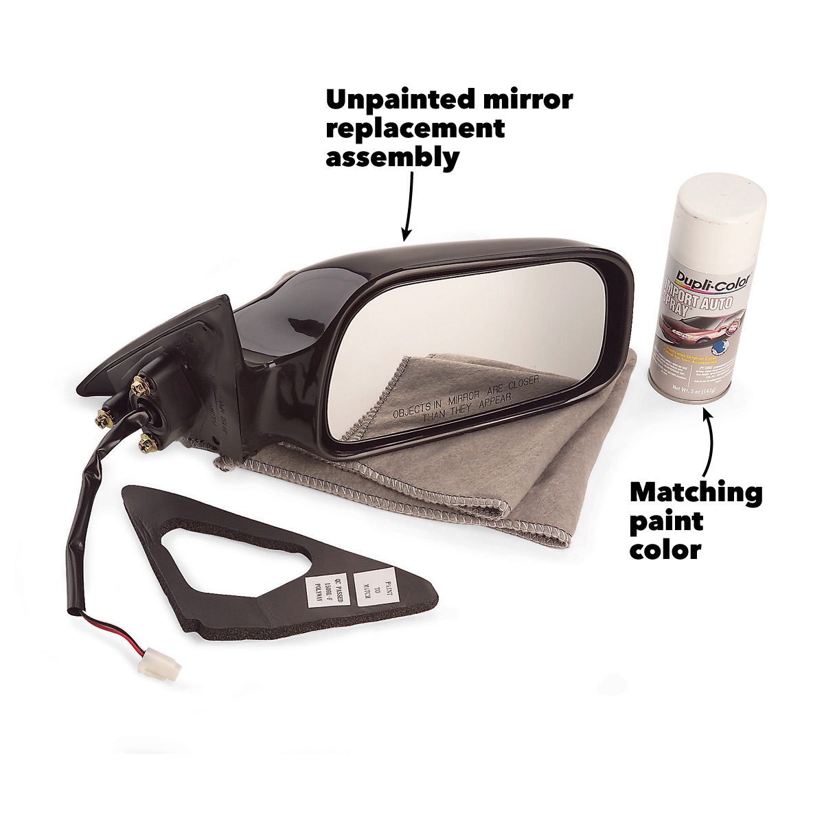 An unpainted mirror replacement assembly rests on a cloth, alongside matching paint spray, with wiring and a backing plate visible.