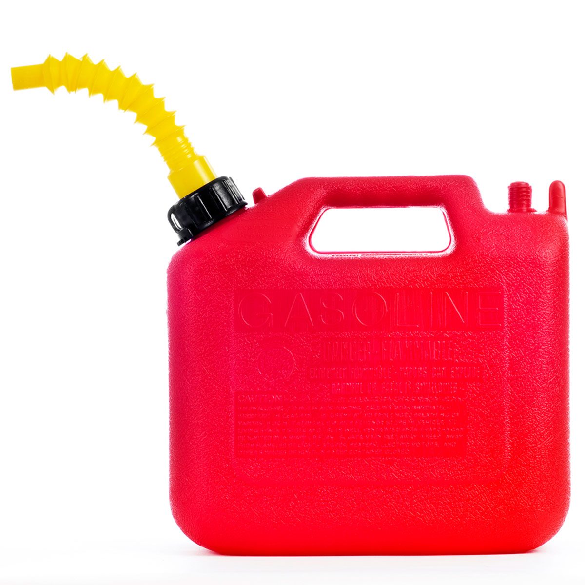 A red gasoline container with a yellow spout rests on a surface, designed for storing and pouring fuel safely.