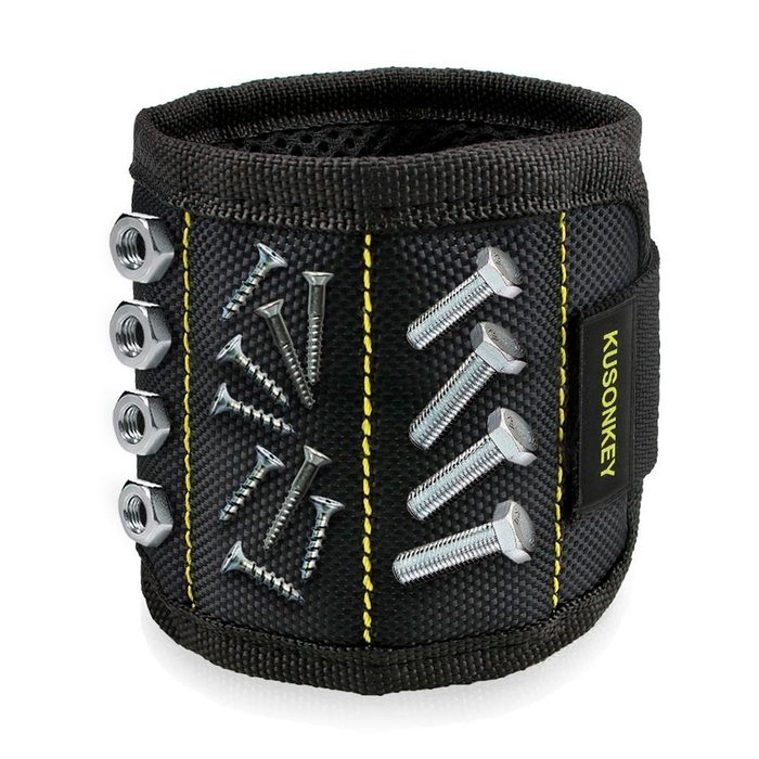 A black magnetic wristband holds metal screws and nuts, designed for easy access during construction or repair tasks in various environments.