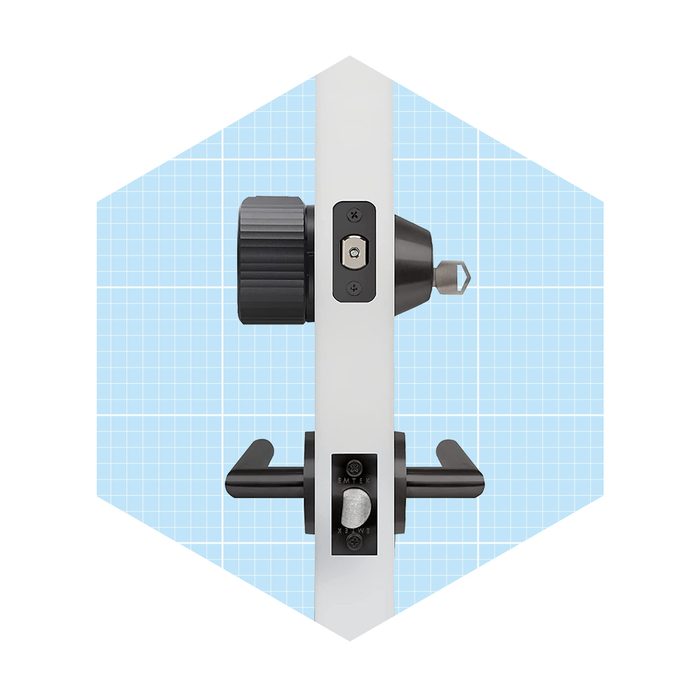 A door lock mechanism is displayed, showing its components and controls, set against a light blue grid background for clarity.