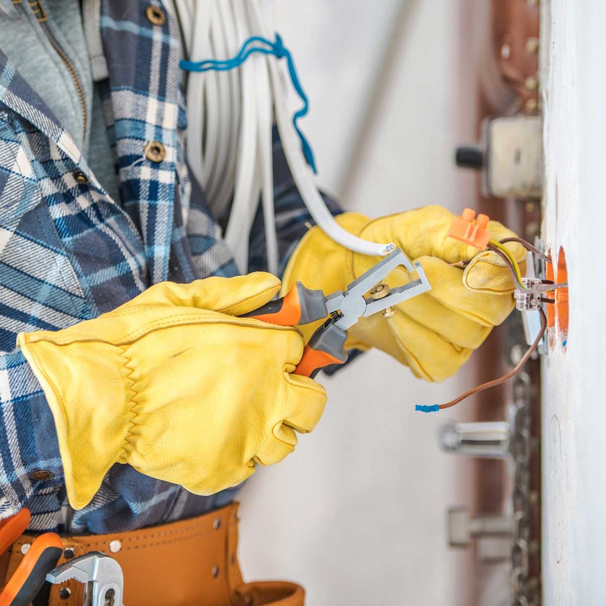 Man clipping wire