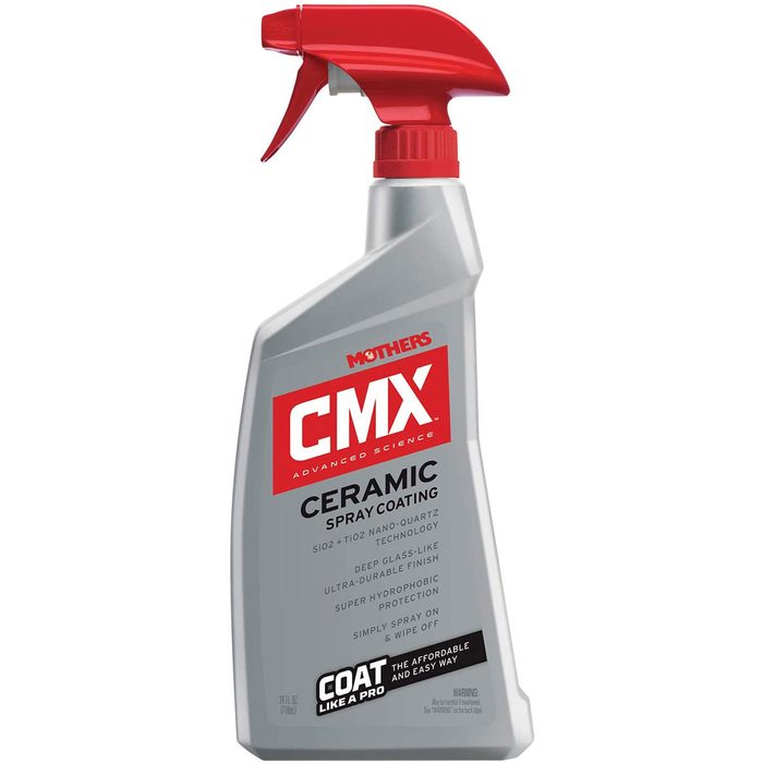 A bottle of ceramic spray coating stands upright, featuring a red trigger spray top. It promotes easy application for durable, protective finishes.