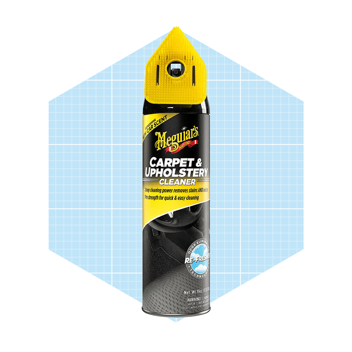 A spray can of carpet and upholstery cleaner is centered against a light blue geometric background, promoting its deep cleaning and quick-use features.