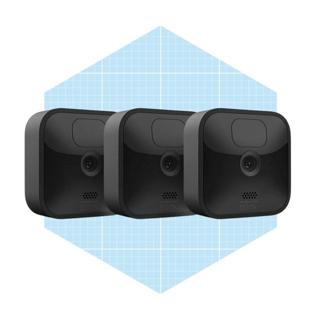 Three identical black security cameras are arranged in a row, positioned against a light blue geometric background that features a grid pattern.