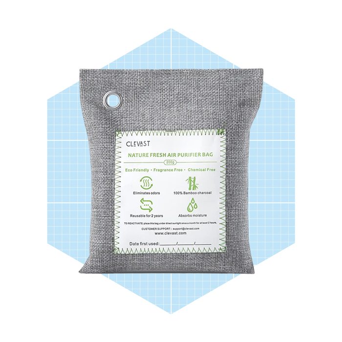 A gray air purifier bag absorbs moisture, eliminates odors, and is reusable for two years. It features eco-friendly and chemical-free branding against a blue background.