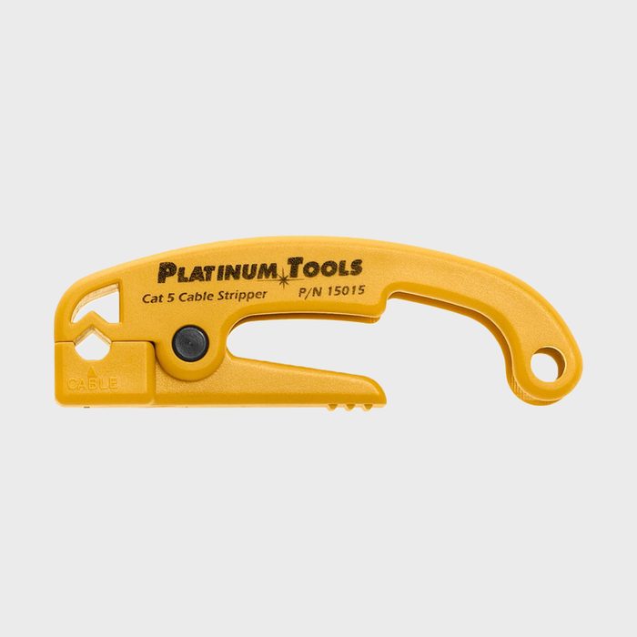 A yellow cable stripper rests horizontally, designed for cutting and stripping Cat 5 cables, displaying brand and product information prominently.