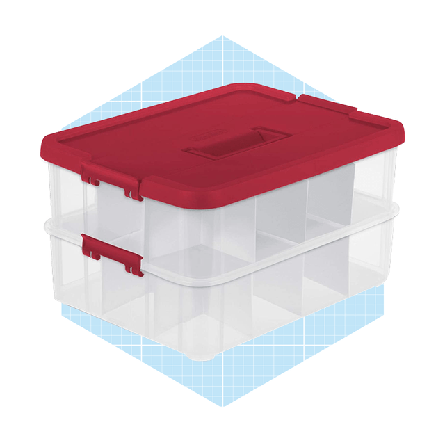 A transparent storage container with a red lid holds multiple compartments, positioned on a light blue grid-patterned background.
