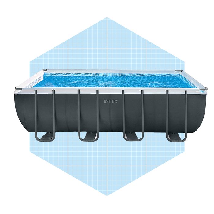 A rectangular above-ground pool filled with blue water, placed on a light blue grid-patterned background, ready for use in a recreational setting.