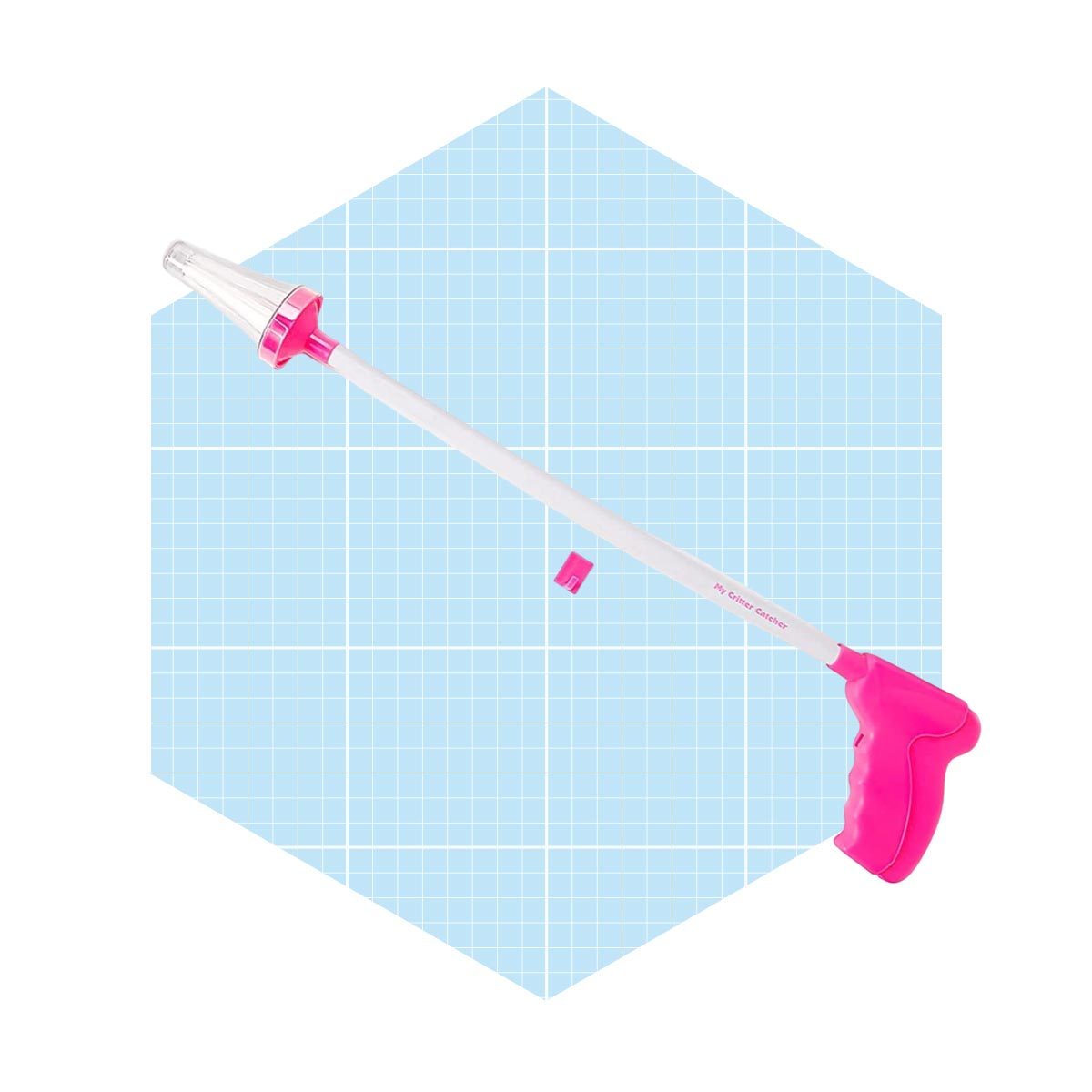 A long, pink-handled tool sits against a light blue grid background, designed for precise application or measurement, featuring a clear tip at one end.
