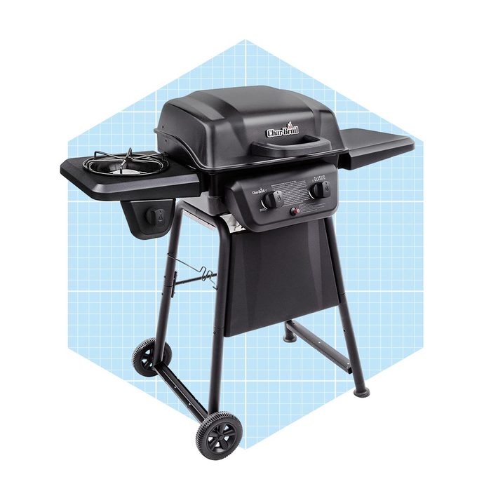 A black gas grill stands on wheels with side tables, featuring controls and a lid. It's set against a light blue grid background.