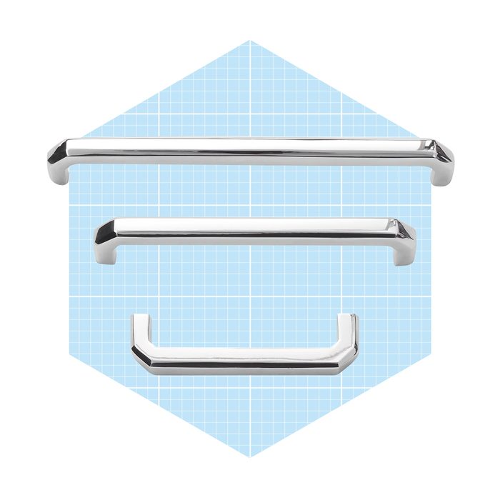 Three chrome cabinet handles are arranged horizontally, showcasing different sizes and designs against a light blue grid background.