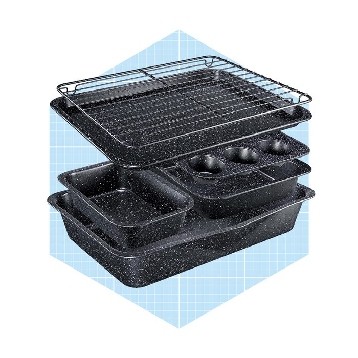 A stacked set of black baking pans and a wire rack, designed for cooking and baking, displayed against a light blue grid background.